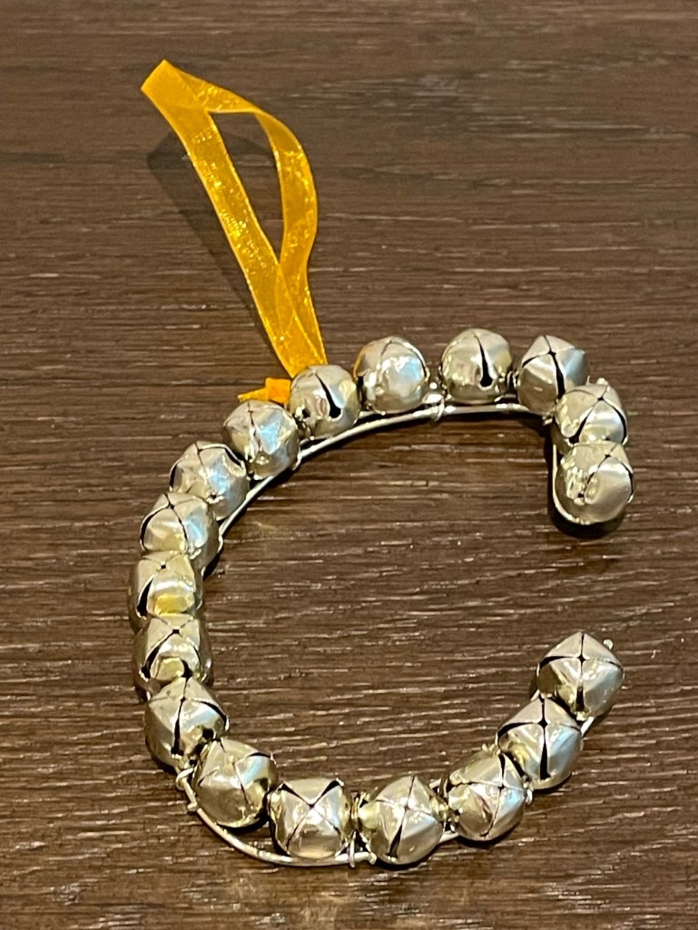 Silver Jingle Bell C-Shaped Ornament with Yellow Ribbon